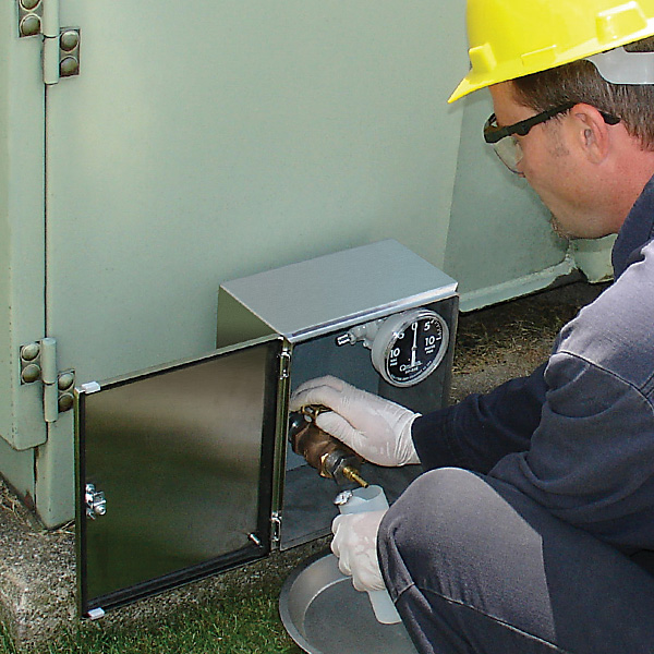 SampleSafe is a stainless steel locking enclosure that mounts to the outside of a cabinet transformer, away from electrical hazards. Since it allows technicians to safely obtain oil samples without opening the cabinet door, it greatly reduces their exposure to dangerous energized equipment.